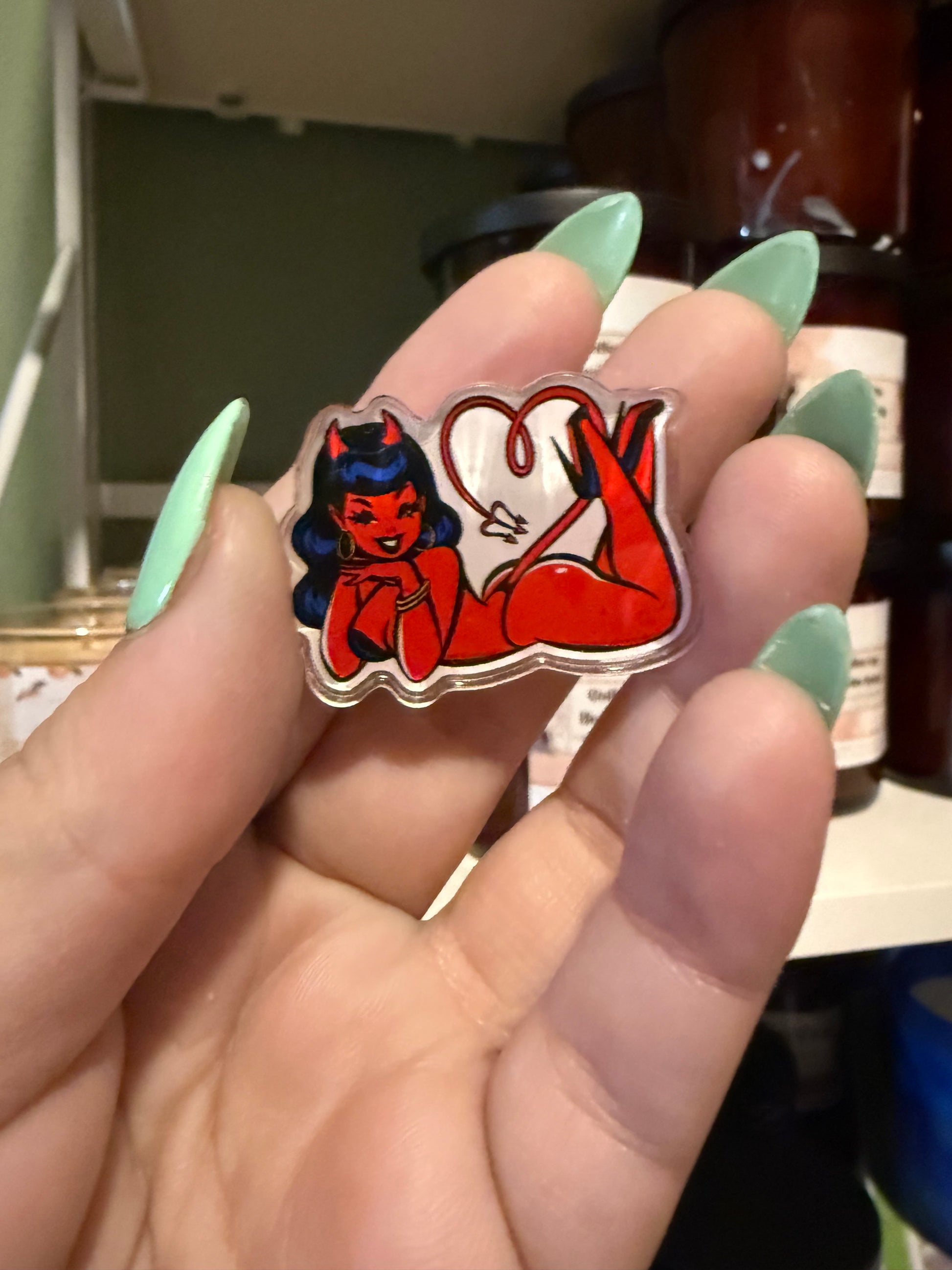 Femme Fatale Series by D.J. Russo Keychains & Pins